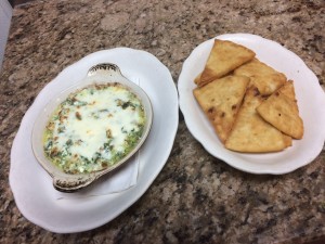 Cheese and spinach dip with side of pita chips