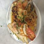 Large seafood platter with salmon, shrimp, oyster and crab